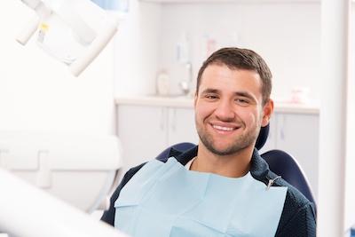 man in dental chair before teeth cleaning in west perth