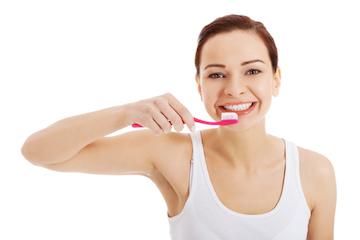 woman brushing her teeth in perth