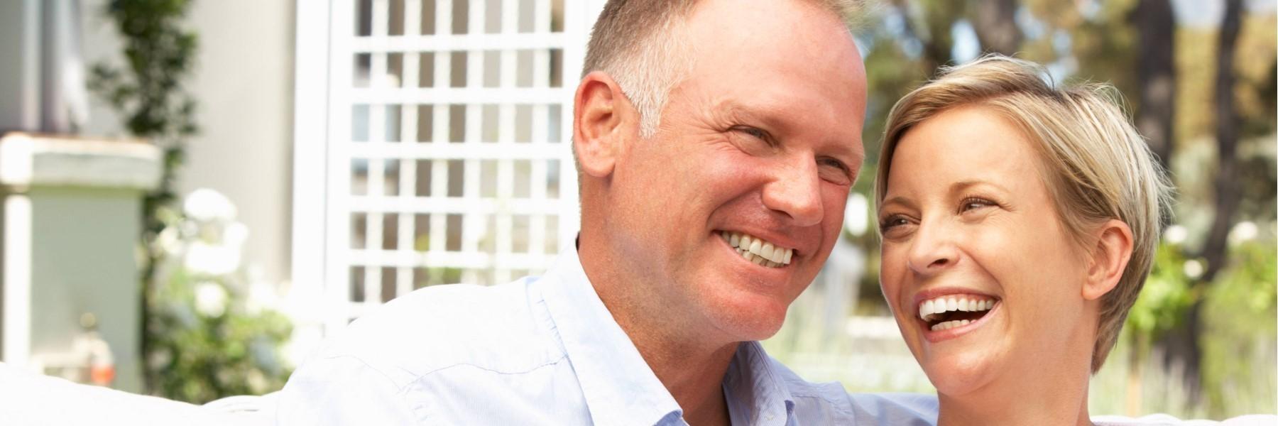 couple with dental implants smiling in west perth